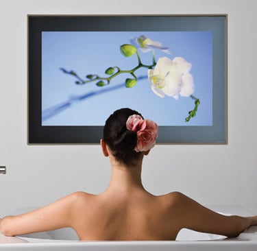 IP65-rated bathroom television mounting with hidden cabling.