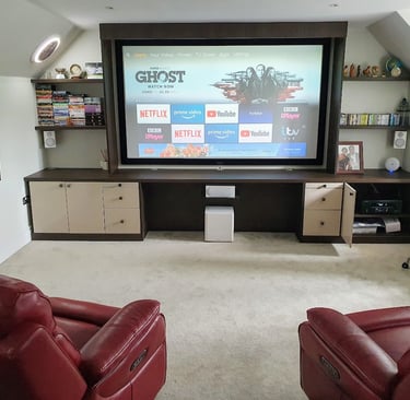 Fixed-frame 4K projector screen mounted in a dedicated home media room with professional optical ali