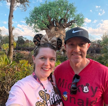 Aimee Cochrane and husband pictured at Disney's Animal Kingdom® inside Walt Disney World®.