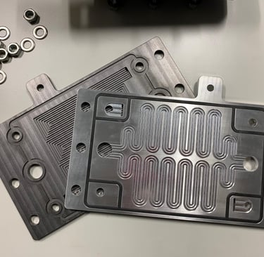 Bipolar flow plates with cooling channels for hydrogen polymer electrolyte fuel cells
