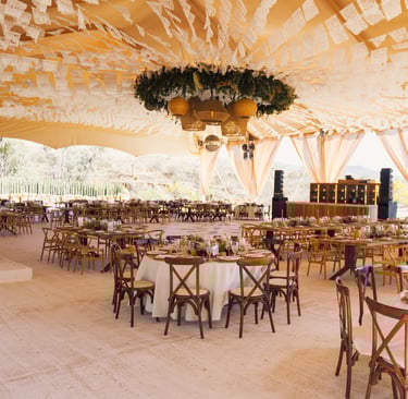 a large tent with tables and chairs and a table