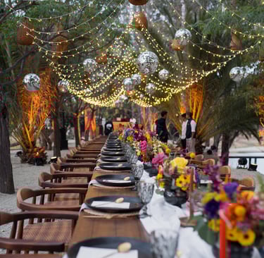 a long table with a long table set for dinner
