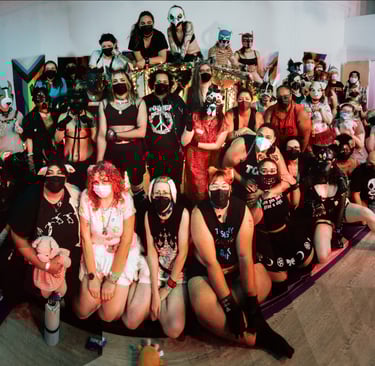 Human pet and animal players posing for a group photo in masks.
