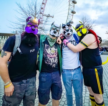 Four friends posing in their pup masks at an amusement park.