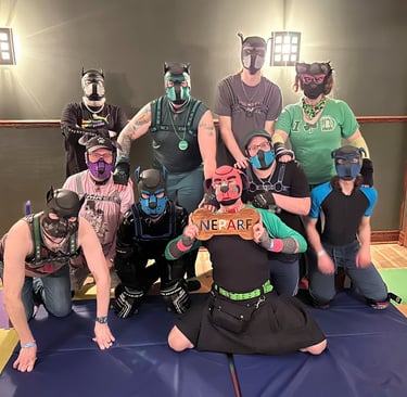 A group photo of people in pup masks. 