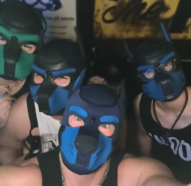 Four men in pup masks posing for picture