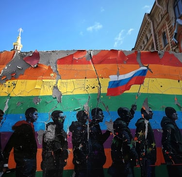 Mural on wall in Russia of LGBTQ protesters. One live man in a pup mask. Art by ai&me
