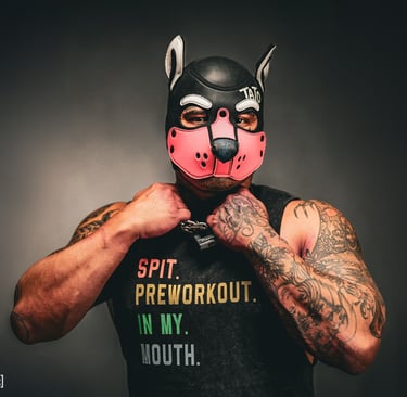 Tato in pup mask with tattoos.