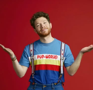 Red haired young man in tshirt and suspenders
