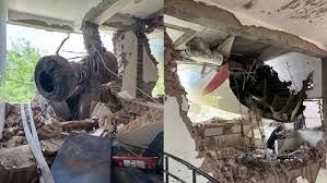 a plane that is sitting on top of a pile of rubble