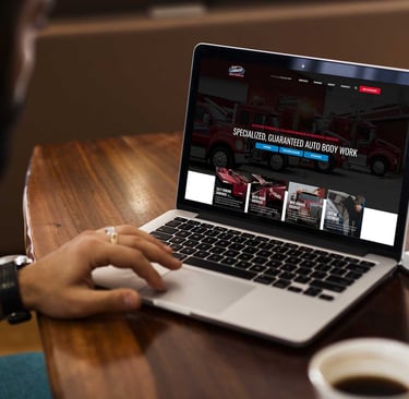 a guy looking at a body shop website