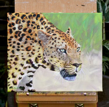 A realistic oil painting of a leopard on a canvas easel, showing detailed spots and intense eyes.