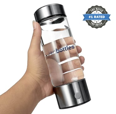 a person holding a bottle of hot water