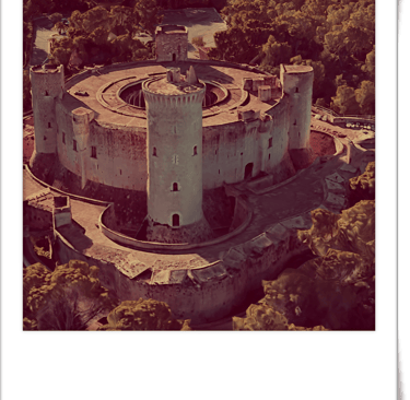 a castle like structure with a tower in the middle of it