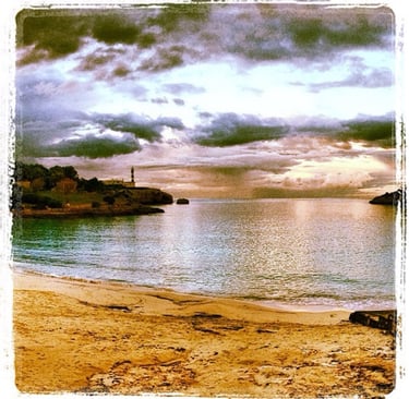 a beach scene with a lighthouse and a lighthouse