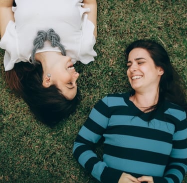 Two friends smiling and laughing