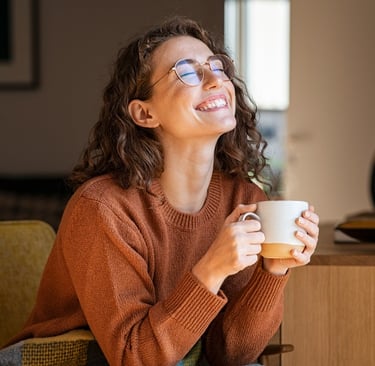 Lady who is taking the time to appreciate what  she has in life and is smiling.
