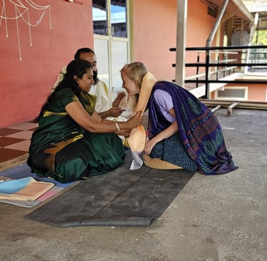 a woman in a green dress sitting on a bench