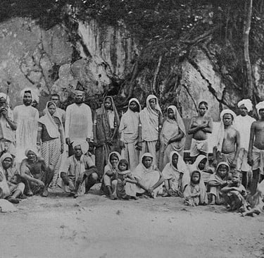 Indentured workers outside their houses somewhere in the caribbean.
