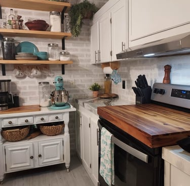 a kitchen with a stove top oven and a microwave