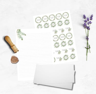 A eucalyptus design on printed paper with matching stickers. Shown with a stack of envelopes 