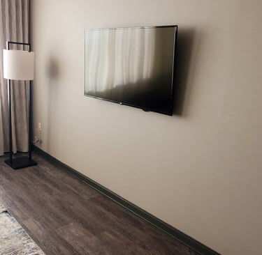 TV mounted on wall in a hotel room