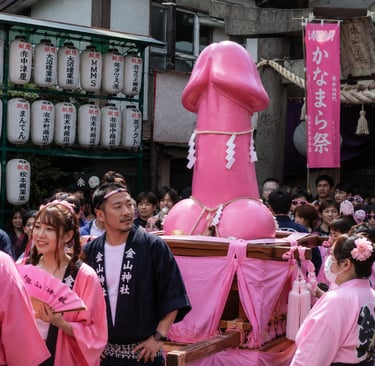 A large pink phallic statue carried on a mikoshi during the Kanamara Matsuri festival in Kawasaki, Japan.