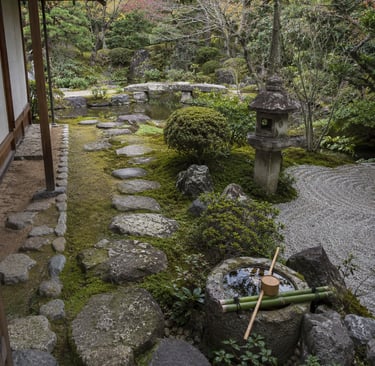 Traditional Japanese zen garden with stepping stones, stone lantern, and tsukubai water basin.