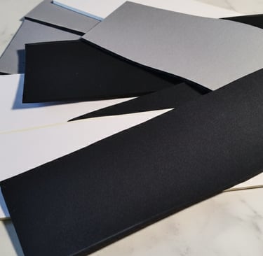 Material samples, white, grey and black.