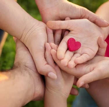 a group of people holding hands in a circle
