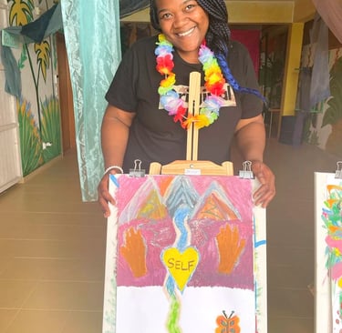 a woman holding a painting of a painting of a woman
