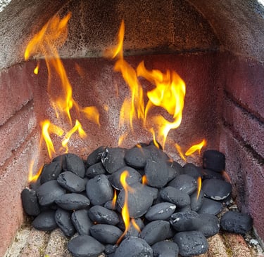 A charcoal bbq and lots of fire
