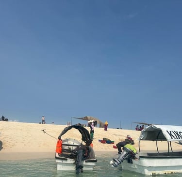 Boat docked at Nakupenda Sandbank with stunning turquoise waters and tropical beach views in Zanzibar, Tanzania