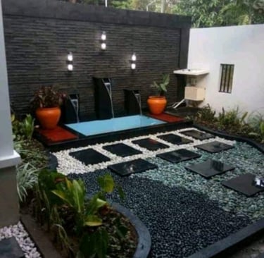 Dekorasi kolam kecil yang cocok di taman lengkap dengan air mancur dan tanaman hias.