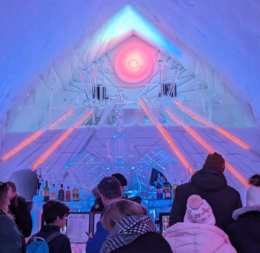 ice hotel evening with people gathered around the bar