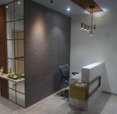 Reception desk design with hanging lights and hidden door with mirror shelf