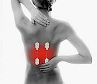 Woman holding her back in pain. Painmaster patches applied to the lower back.
