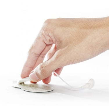 Single hand removing Painmaster leads from patch.