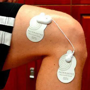 Painmaster patches applied to the knee.