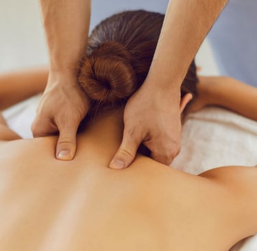 a woman getting a massage at a spa