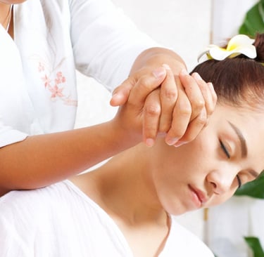 a woman getting a massage at a spa