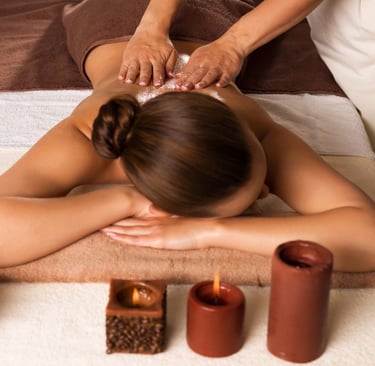 a woman getting a massage at a spa