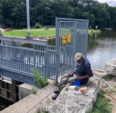A fisherman baits his hook at the Dam in Montello, Wisconsin. 