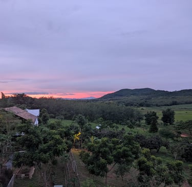 Sunset view across Loei Valley with orchard and foothills in North-Eastern Thailand