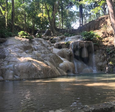 Small forest waterfall in Loei flowing in early season light