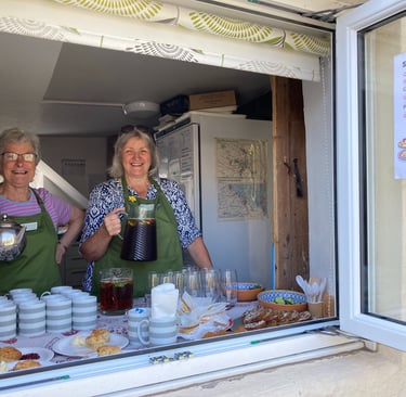Westbury-sub-Mendip Community Shop Volunteers serving breakfast at an event