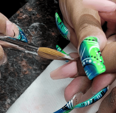 a person is doing a manicure with a brush and a brush