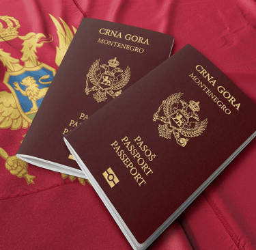 Two passports from Montenegro on the Montenegrin flag