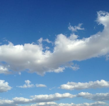 Beautiful baby blue sky with big white cumulus 