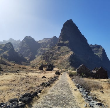 Stone path leading past mountain ruins along the scenic coast of Santo Antao, Cape Verde.